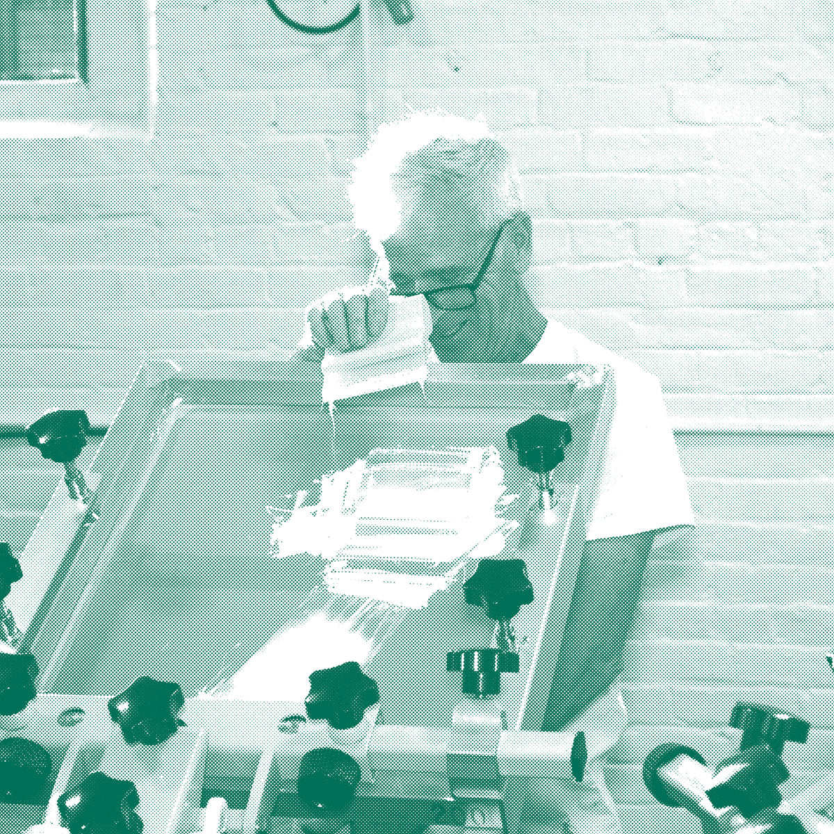 Geof Seitz, Creative Director at Frontside Factory, looks pleased with the quality of a custom screen print